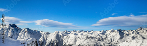 Panoramic landscape of ski resort valley with amazing beatiful mountains and dramatic cloudy sky on the background in Austria, Tyrol