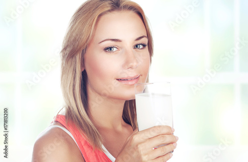 Beautiful woman drinking milk