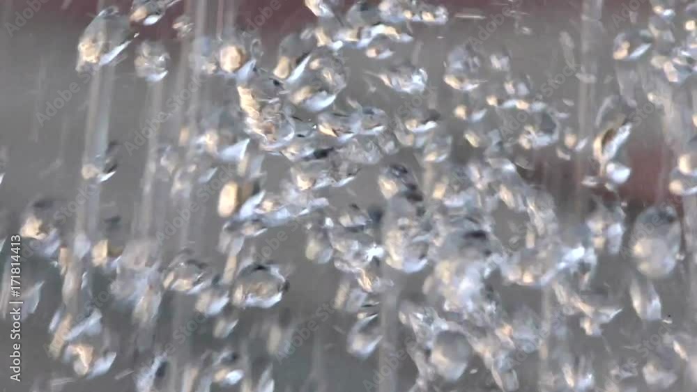 Drops of the fountain close. Water texture in motion. Design of parks and houses are decorated with fountains. Drops of the fountain close. Water texture in motion. Design of parks and houses are decorated with fountains.