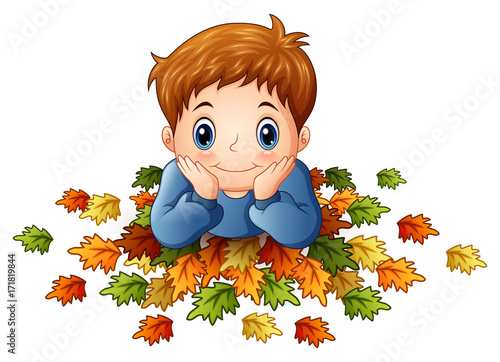 Cute little boy with autumn leaves