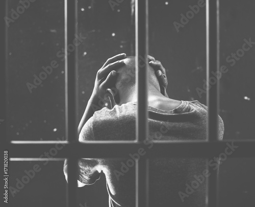 Fotótapéta Criminal man stressing on the jailed