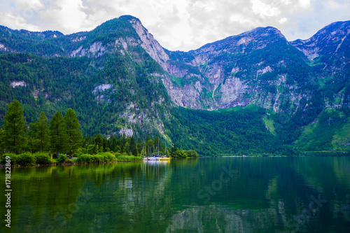 Popular beautiful village in Austria ,Hallstatt in the green summer scenery and crystal clear water 