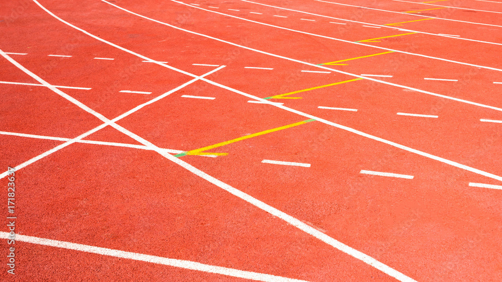 red running track on athletic stadium
