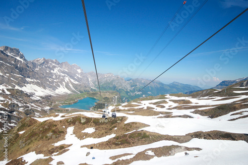 Mt. Titlis, Switzerland - 19 May, 2016:From the viewpoint through the glass windows in the 360 degree panoramic cable car, the popular tourist attractions of Switzerland.