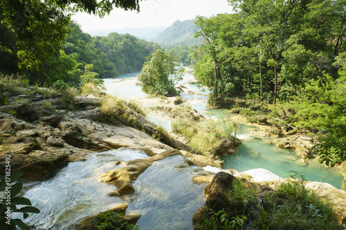 View of valley from waterfall to river on the cliffs in tropical lake at sunny summer day
