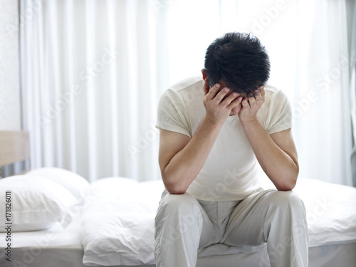 asian man suffering from insomnia photo