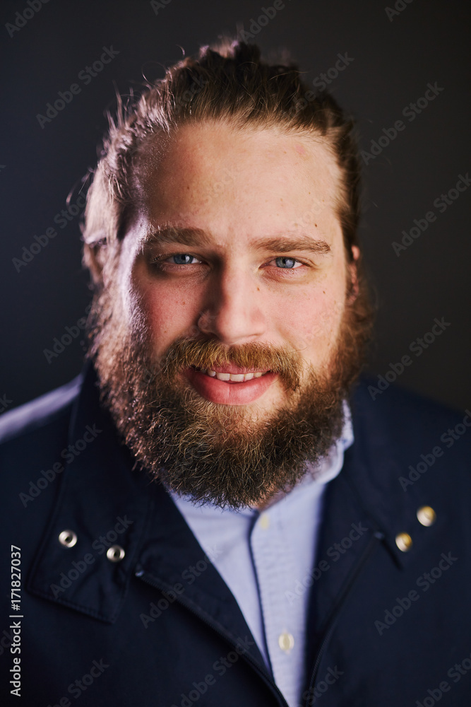 Fototapeta premium man with beard and long hair smiling close up