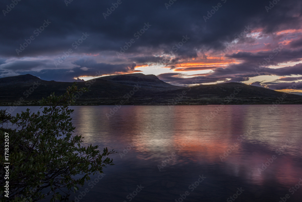 A quiet Norwegian lake at sunset in the Rondane National Park in Norway - 9
