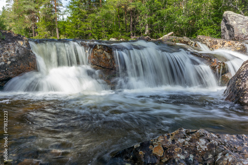 A waterfall in a wild forest in a national park in Norway - 2