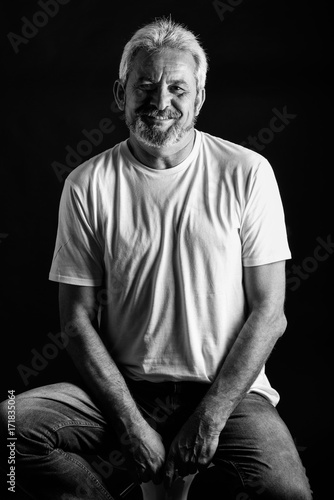 Mature man with white hair and beard smiling © javiindy