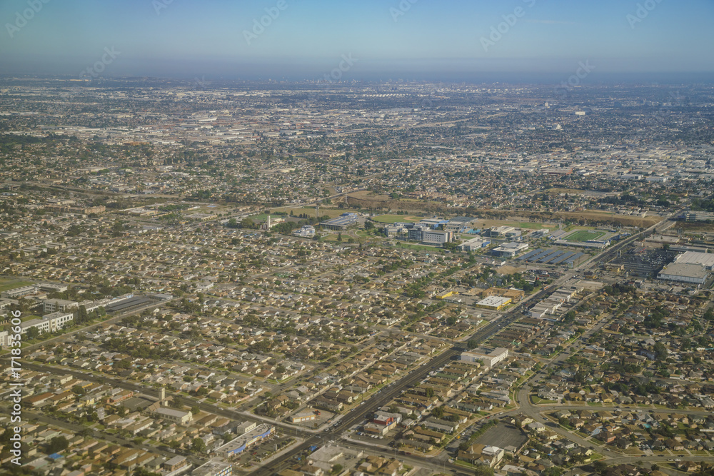 Aerial view of cityscape, view from window seat in an airplane