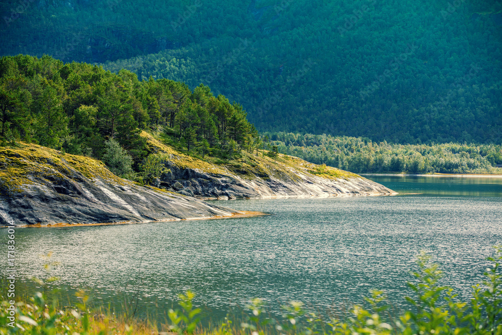 Obraz premium View of the fjord. Rocky seashore. Beautiful nature of Norway