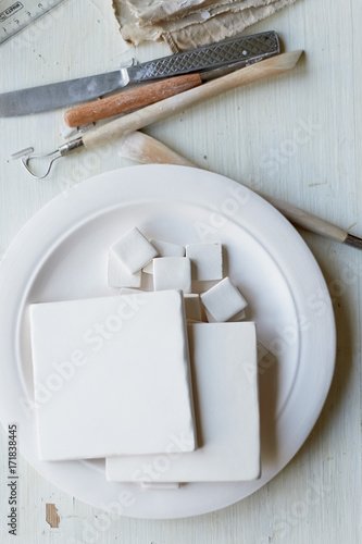 The workplace of ceramist. Blanks for painting. A creative workshop . Minimalistic composition in bright colors