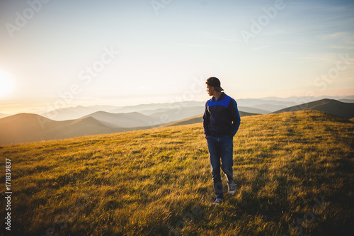 Young Boy Walk Through the Mountains