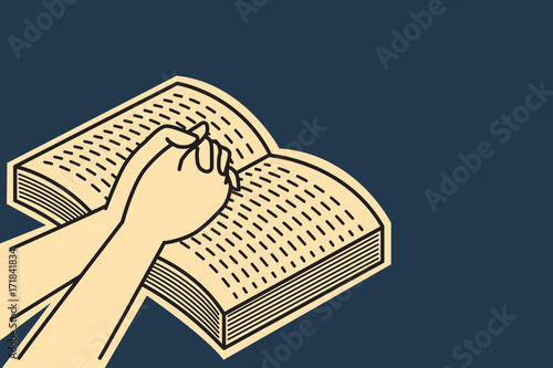 Praying on open bible book