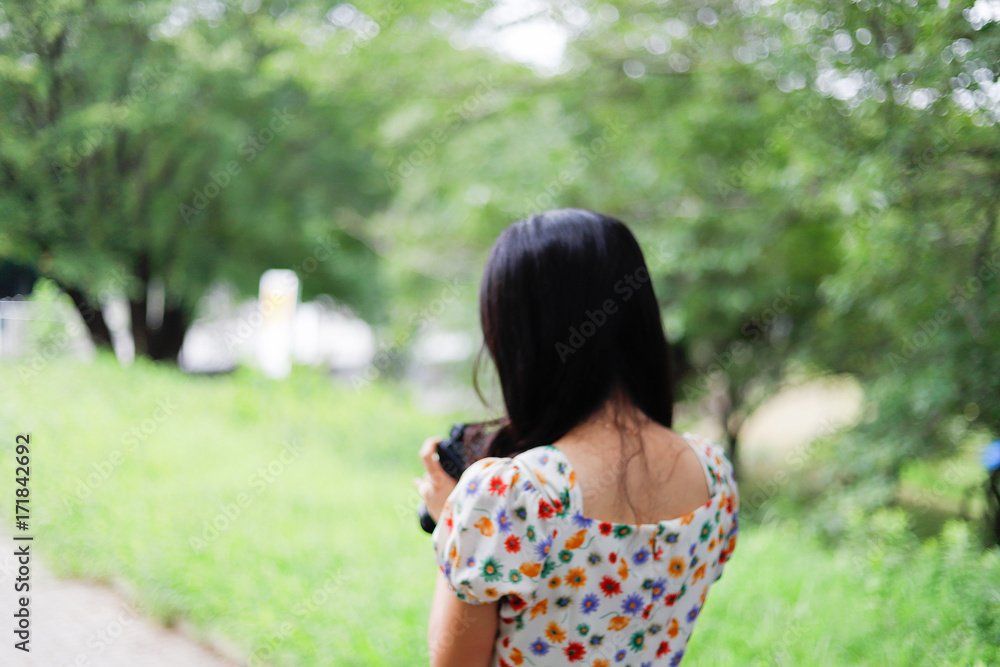 a portrait of beautiful woman in the park a portrait of beautiful woman in the park