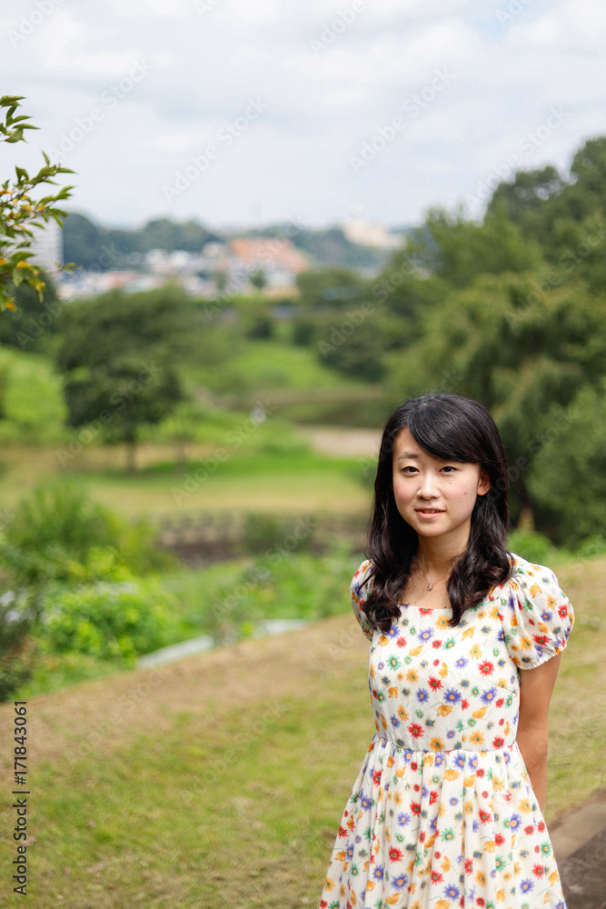 a portrait of beautiful woman in the park a portrait of beautiful woman in the park