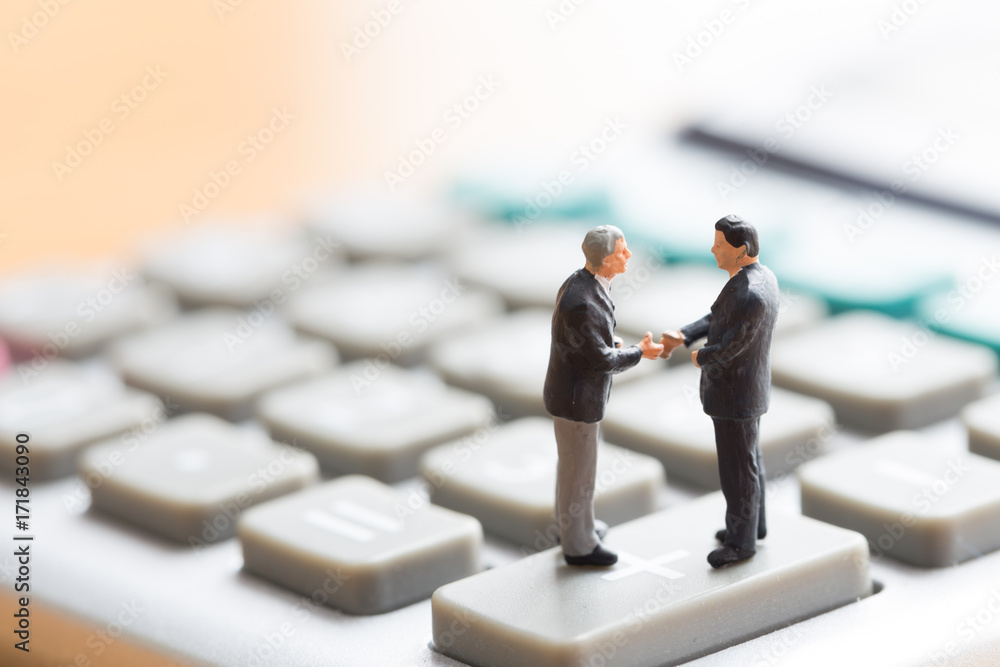 Businessmen shake hands and agree to work together Businessmen shake hands and agree to work together