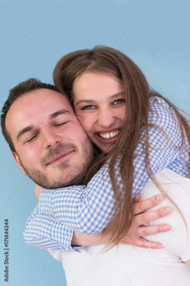 Fototapeta premium young man piggybacking his girlfriend