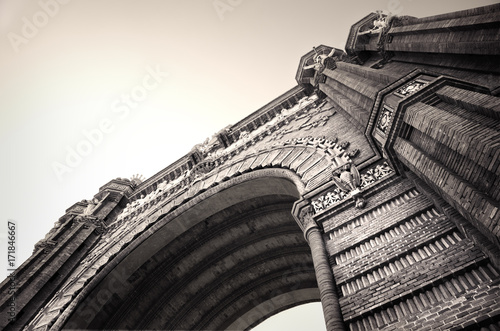 Canvas Print A wide angle black and white shot  of The Arc de Triomf or Arco de Triunfo in Spain, is a triumphal arch in the city of Barcelona in Catalonia, Spain