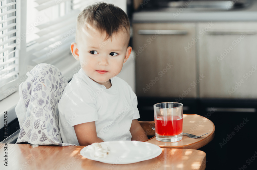 Two years boy drinking compote Two years boy drinking compote
