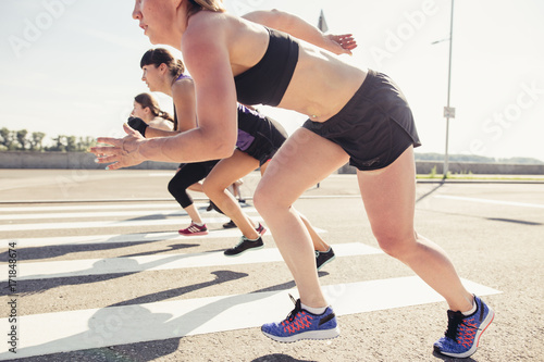 Group of cross fit runners starting race photo