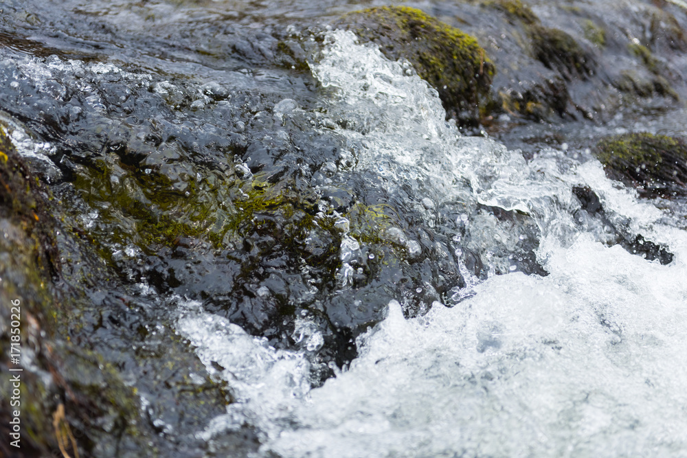 A beautiful river wave photographed close up ,causing calm waves and bubbles. The water is clean and transparent like glass A beautiful river wave photographed close up ,causing calm waves and bubbles. The water is clean and transparent like glass