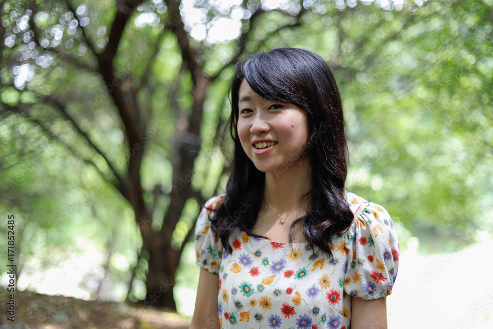 a portrait of beautiful woman in the park a portrait of beautiful woman in the park
