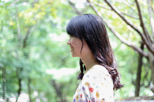 a portrait of beautiful woman in the park