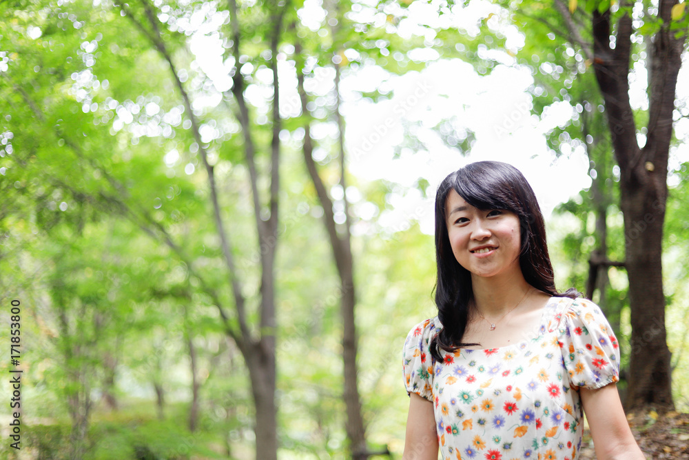 a portrait of beautiful woman in the park a portrait of beautiful woman in the park