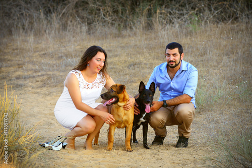 young couple with two dogs