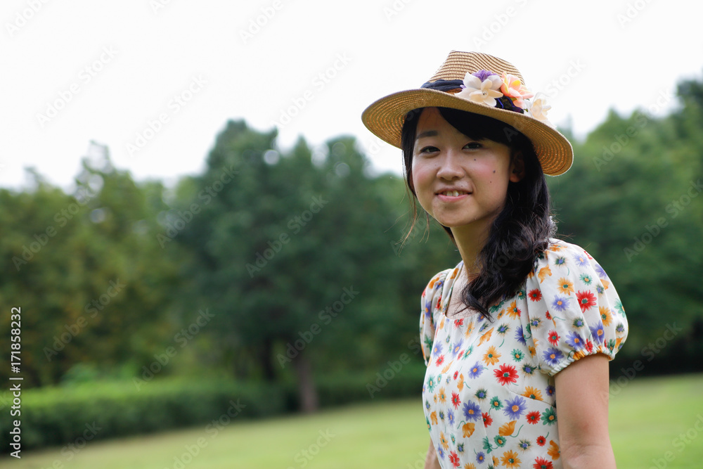 a portrait of beautiful woman in the park