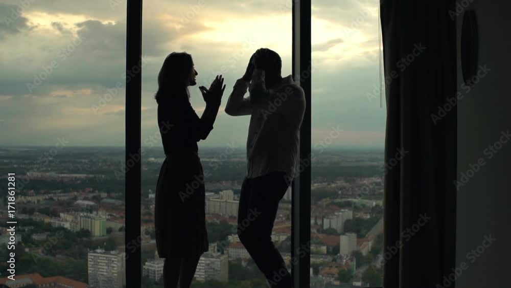 Silhouette of couple fighting, arguing by window at home, super slow motion 120fps
Silhouette of couple fighting, arguing by window at home, super slow motion 120fps
