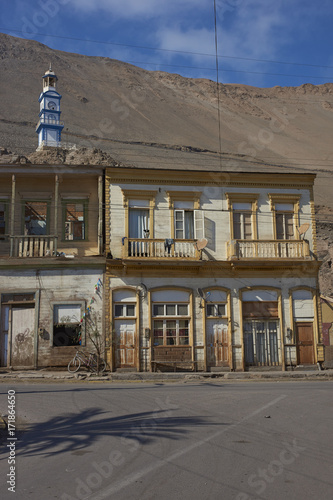 Historic wooden buildings from the era of nitrate mining in the Atacama Desert, in the coastal town of Pisagua in northern Chile. photo