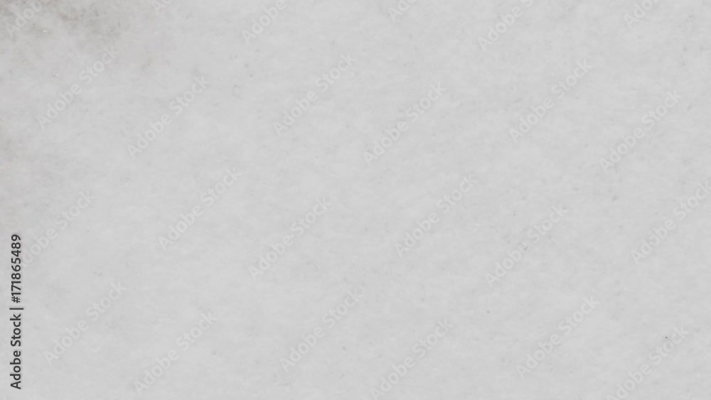 Slow motion closeup black ink spreading on wet paper top view Slow motion closeup black ink spreading on wet paper top view