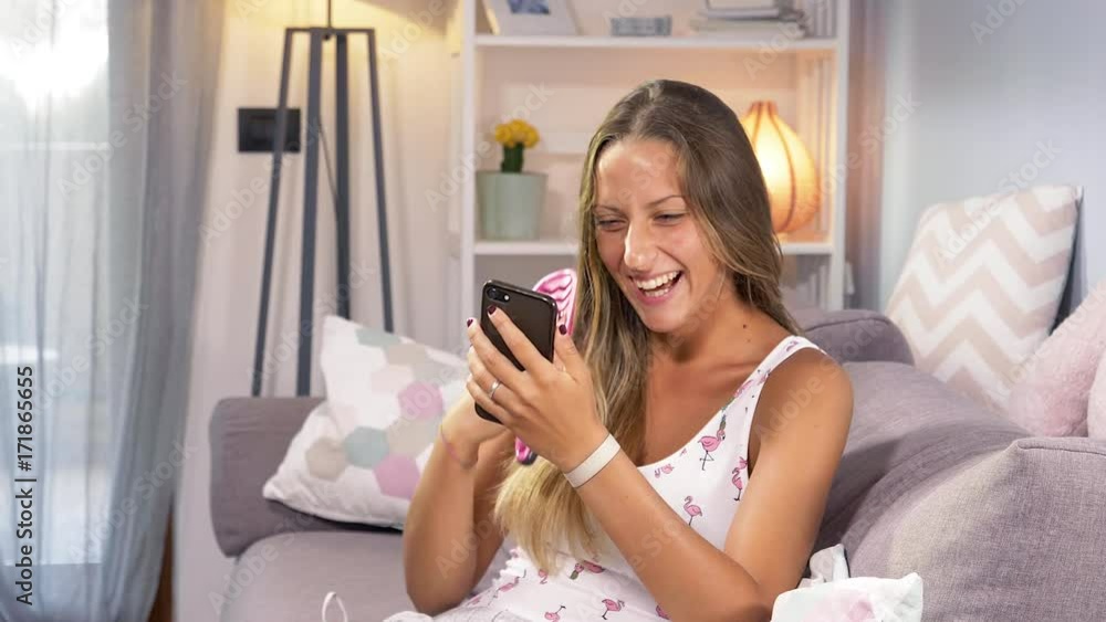 Happy woman laughing reading message on social network 4K slow motion Happy woman laughing reading message on social network 4K slow motion