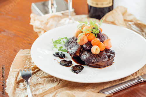 Grilled ribeye beef steak, herbs and spices. Top view photo