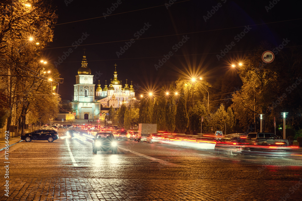 St. Michael's Golden-Domed Monastery and road in Kyiv at night