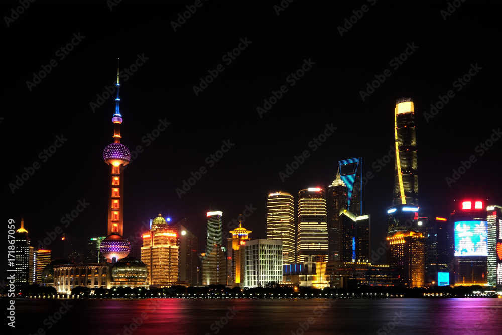 Shanghai tower long-exposure scene from the Bund area across Huangpu river at Pudong province, China at night time Shanghai tower long-exposure scene from the Bund area across Huangpu river at Pudong province, China at night time