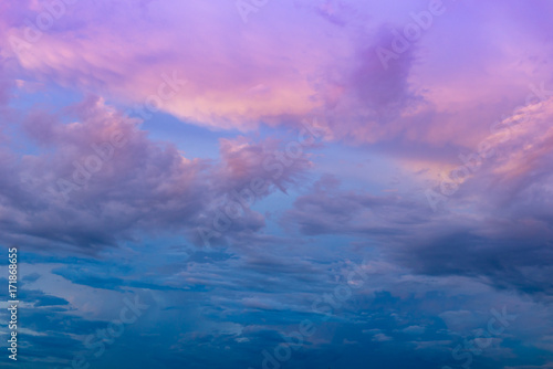 Abstract blur of dramatic amazing sky with clouds in sunset or sunrise time; ideal use for background