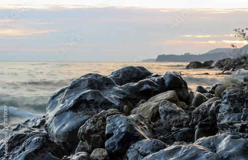Wallpaper Mural wet stones on the shore, stones on sea coast, black stones, black stone, seascape Torontodigital.ca