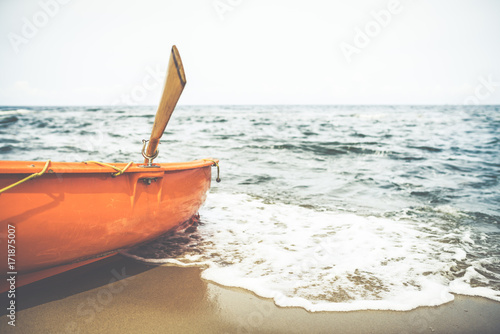 Fototapeta Naklejka Na Ścianę i Meble -  Orange lifeguard rescue boat