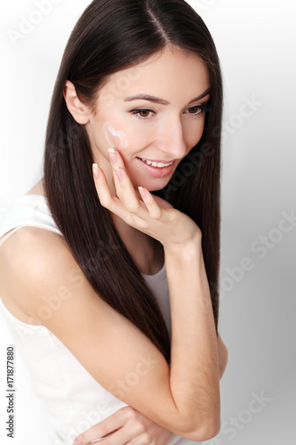 Beauty Skin Care. Beautiful Woman Applying Cosmetic Face Cream © Maksymiv Iurii