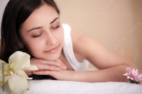 Spa Massage. Beautiful Brunette Gets Spa Treatment in Salon.