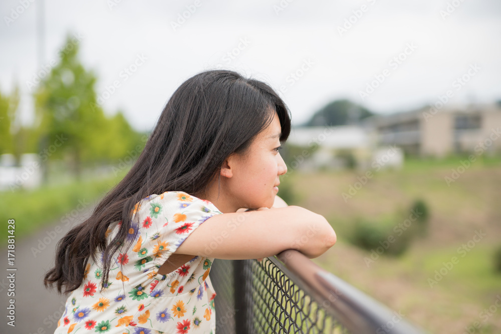a portrait of beautiful woman in the park