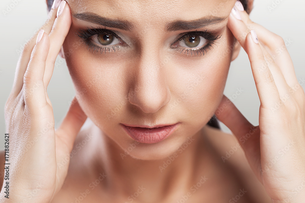 Health And Pain. Stressed Exhausted Young Woman Having Strong Tension Headache. Closeup Portrait Of A Beautiful Sick Girl Suffering From Head Migraine, Feeling Pressure And Stress. Health And Pain. Stressed Exhausted Young Woman Having Strong Tension Headache. Closeup Portrait Of A Beautiful Sick Girl Suffering From Head Migraine, Feeling Pressure And Stress.