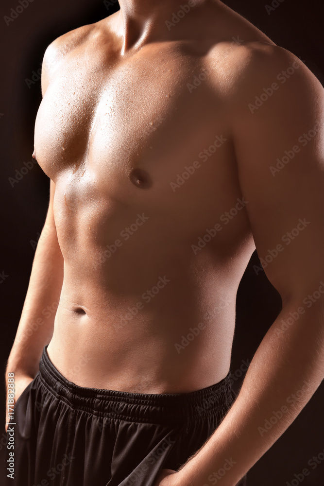 Sporty young man on dark background Sporty young man on dark background