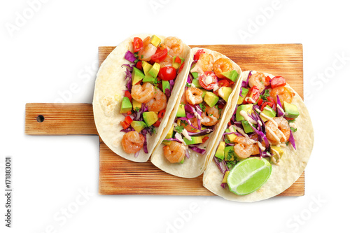 Wooden board with delicious shrimp tacos, isolated on white