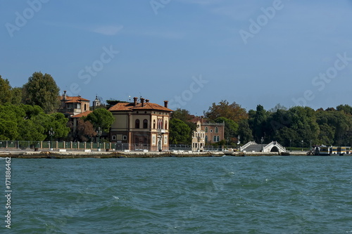 View from the sea at the residential district of waterside with bridge in Venezia, Venice, Italy, Europe 