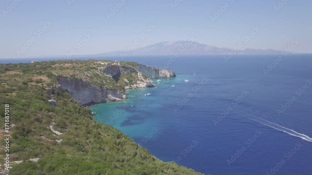 4K (UHD) Aerial view of Agios Nikolaos blue caves in Zakynthos (Zante) island, in Greece - Log 4K (UHD) Aerial view of Agios Nikolaos blue caves in Zakynthos (Zante) island, in Greece - Log